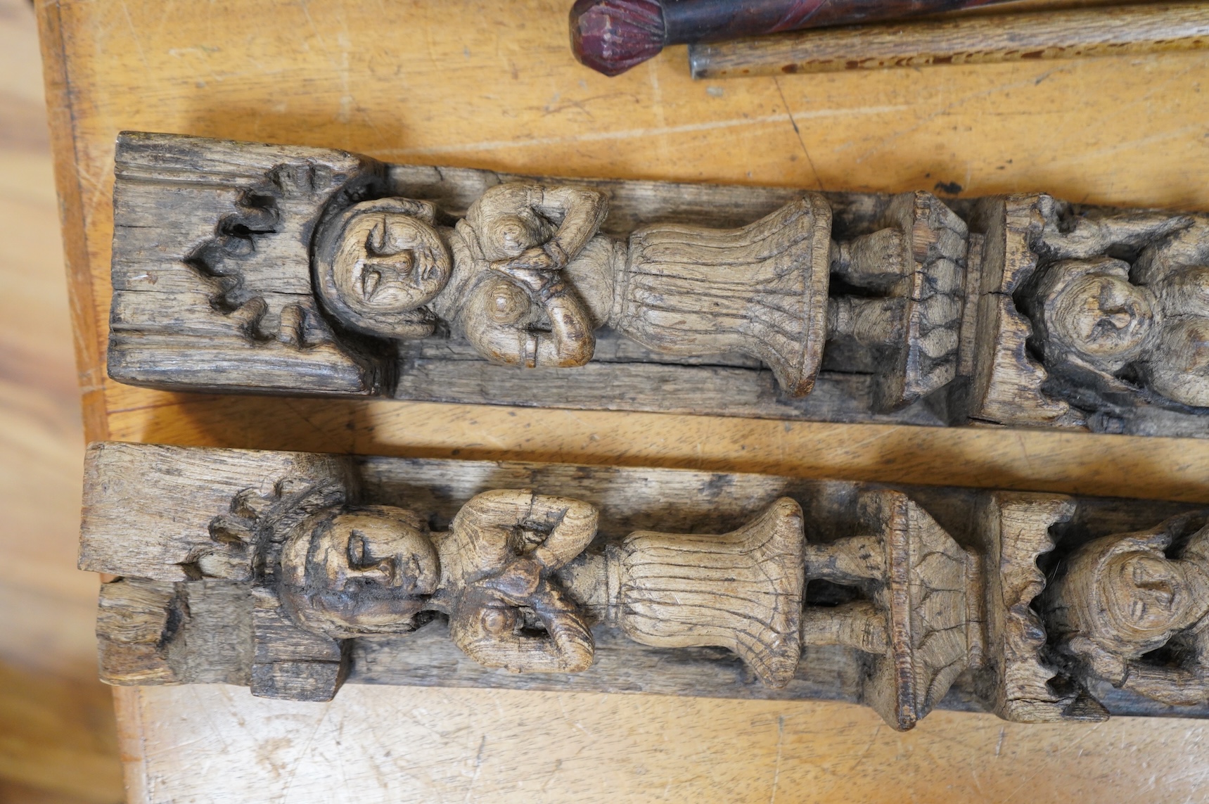 A pair of 19th century Indian carved wood figural pilasters - 74cm long